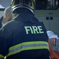 Paramedics and firemen standing